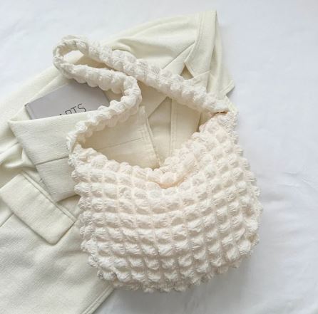 Bolso de mano acolchado