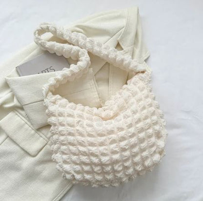 Bolso de mano acolchado